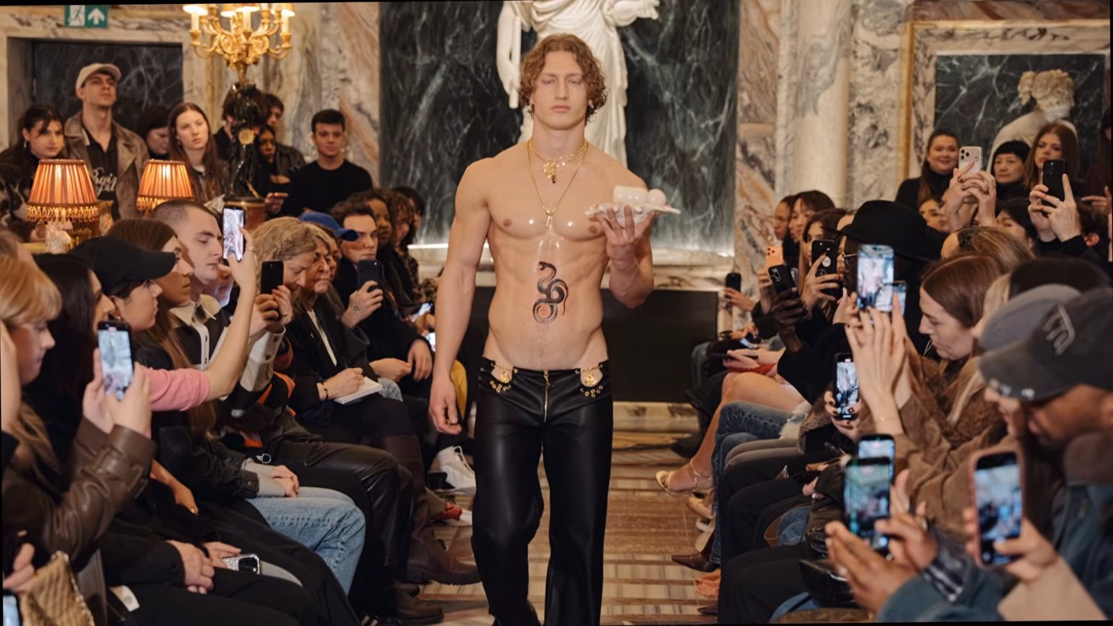 Models wore freshly inked snake tattoos and raw crystal headpieces that covered their eyes.