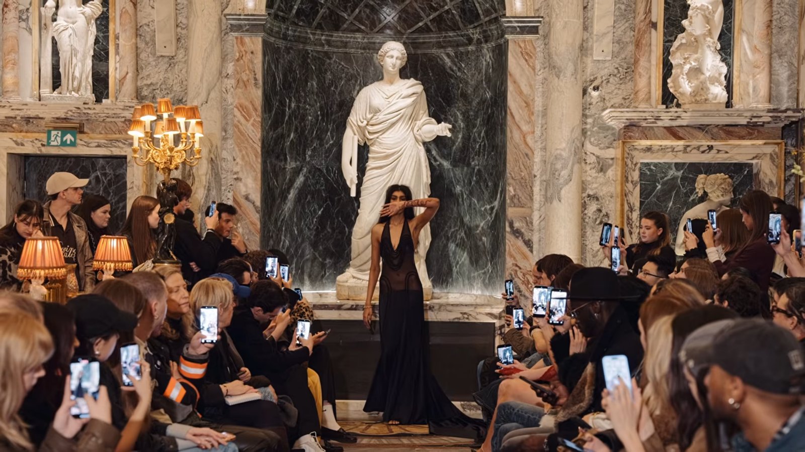 Models walked past marble sculptures, meant to read as Medusa’s former lovers, at Bacchanalia in Mayfair, a restaurant with interiors by Martin Brudnizki Design Studio and statues by Damien Hirst.