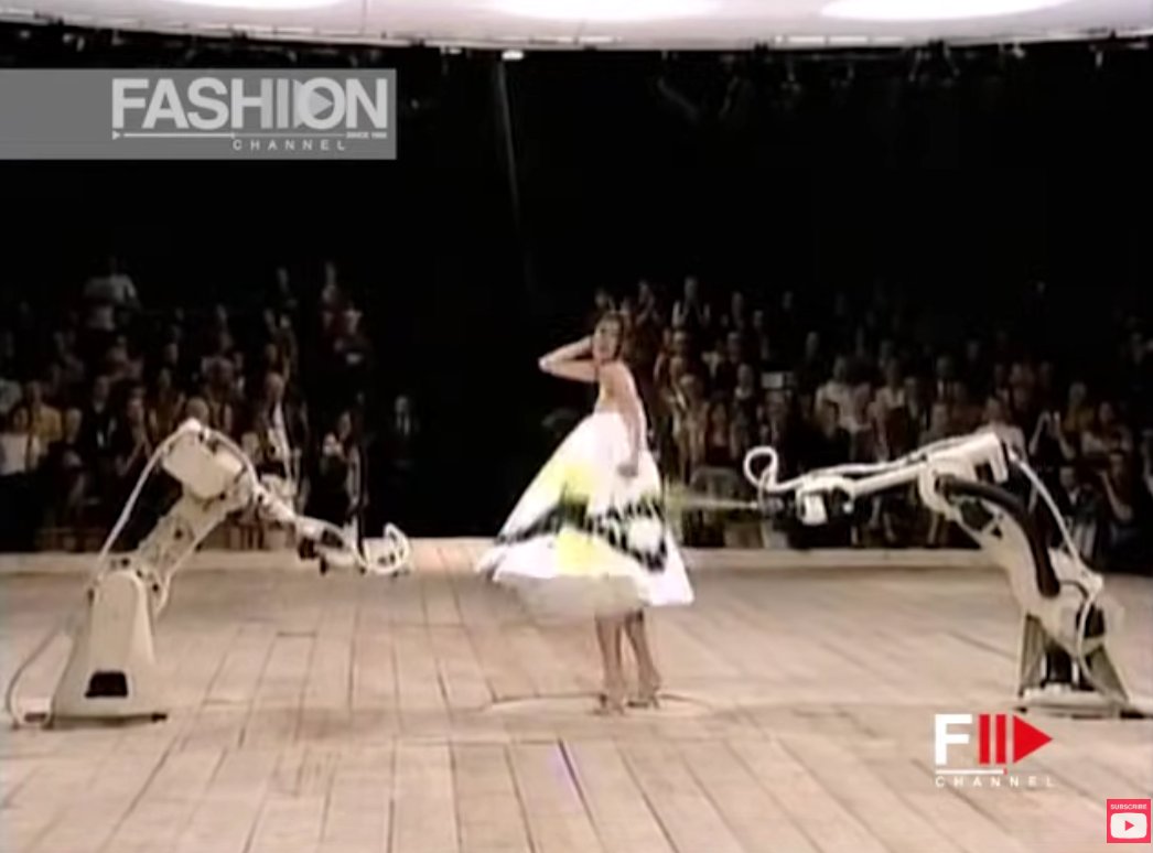 The iconic moment where robots pray pain the dress..