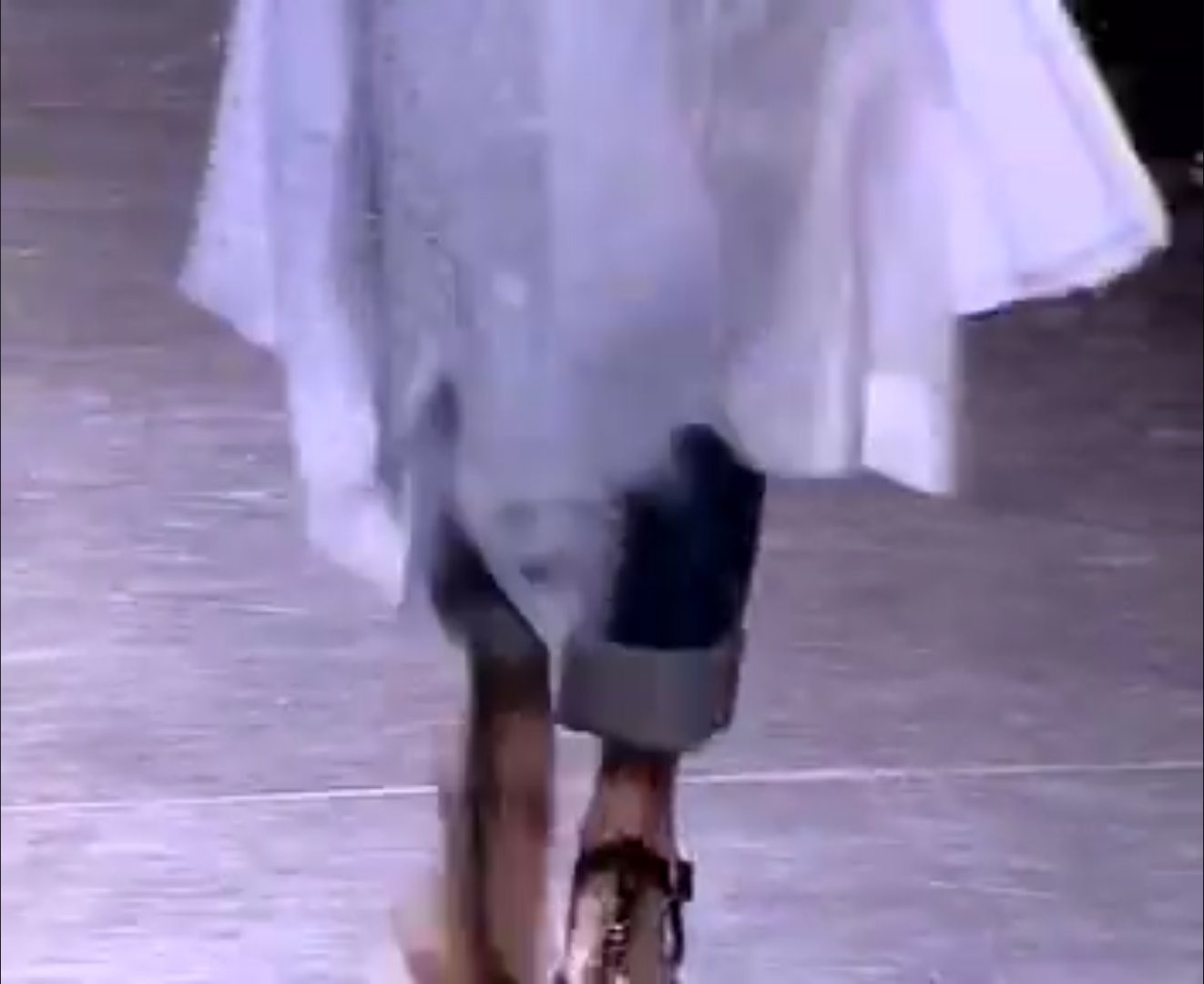 Vogue's review made a point of calling out the crisscross flat leather sandals as some of the most wearable, comfortable footwear seen on any runway that entire season, a small detail, but a notably practical one for a designer known for conceptual extremes.