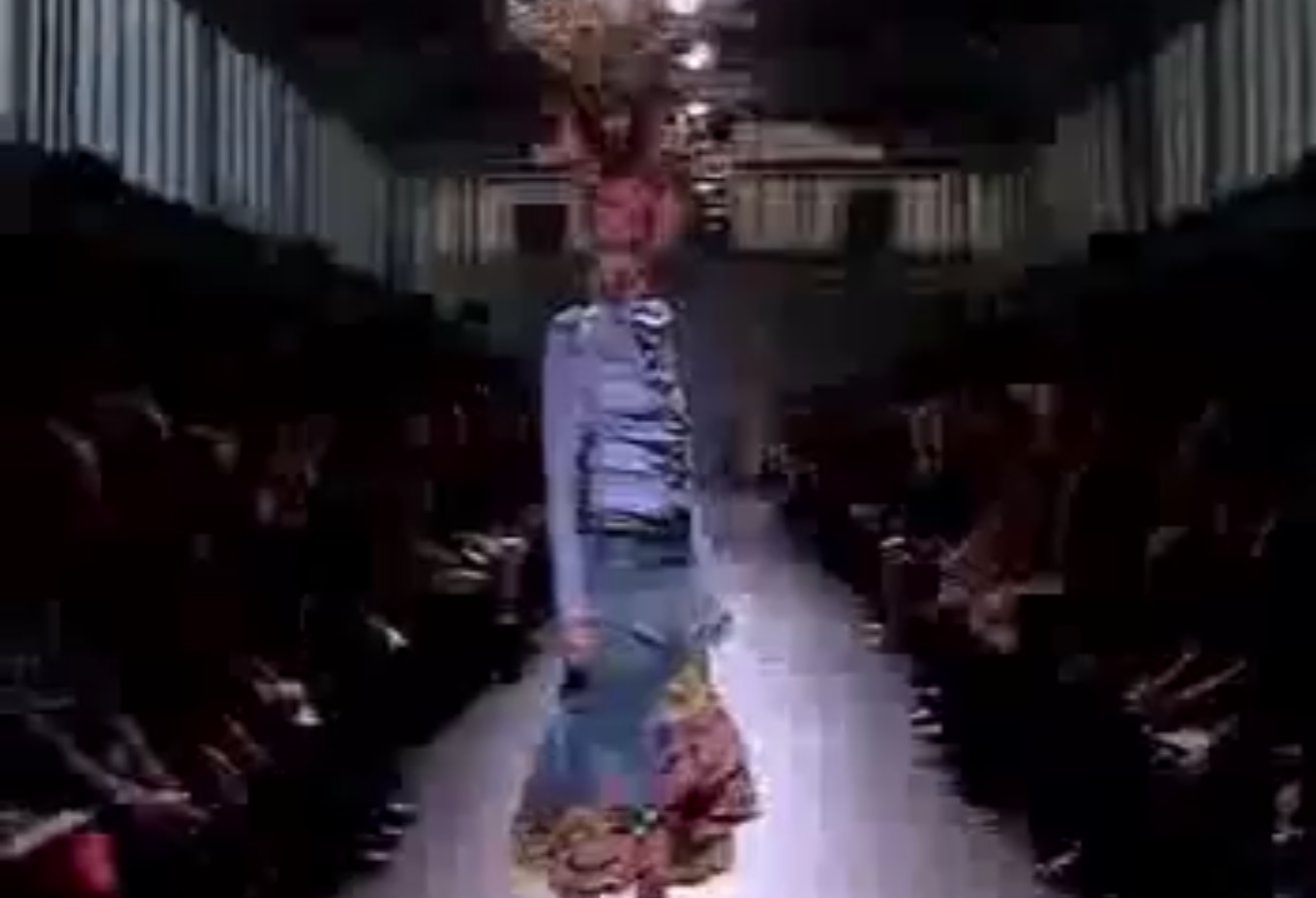 Multiple reviewers singled out the towering, sculptural head wraps, some carrying actual flower sheaves, as the single most striking element of the whole presentation.