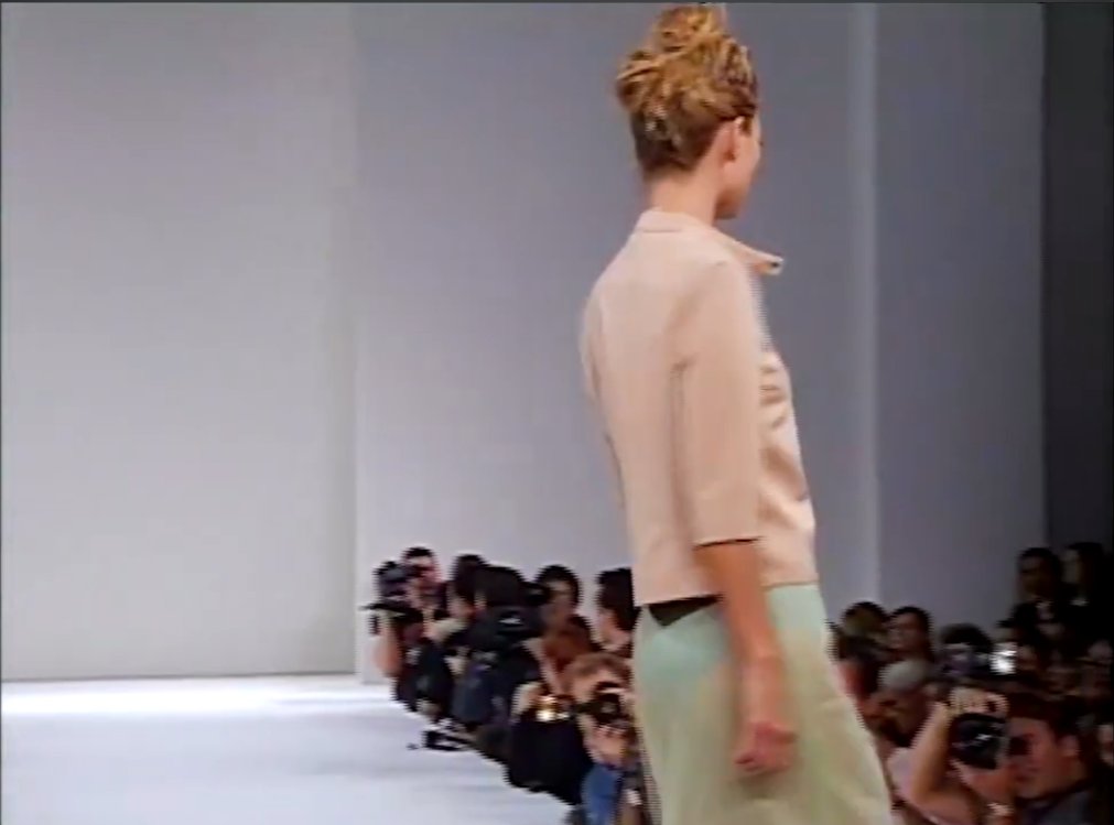 The "pretty/ugly" aesthetic on display here would define Miuccia's entire mid-90s run. This same season, her Prada mainline shows were being savaged by critics for the same muddied, deliberately "ugly" color palette, Washington Post critic Robin Givhan wrote flatly that "Prada is still ugly." What read as discordant to critics in 1996 is now treated as one of the most influential aesthetic shifts in 1990s fashion.