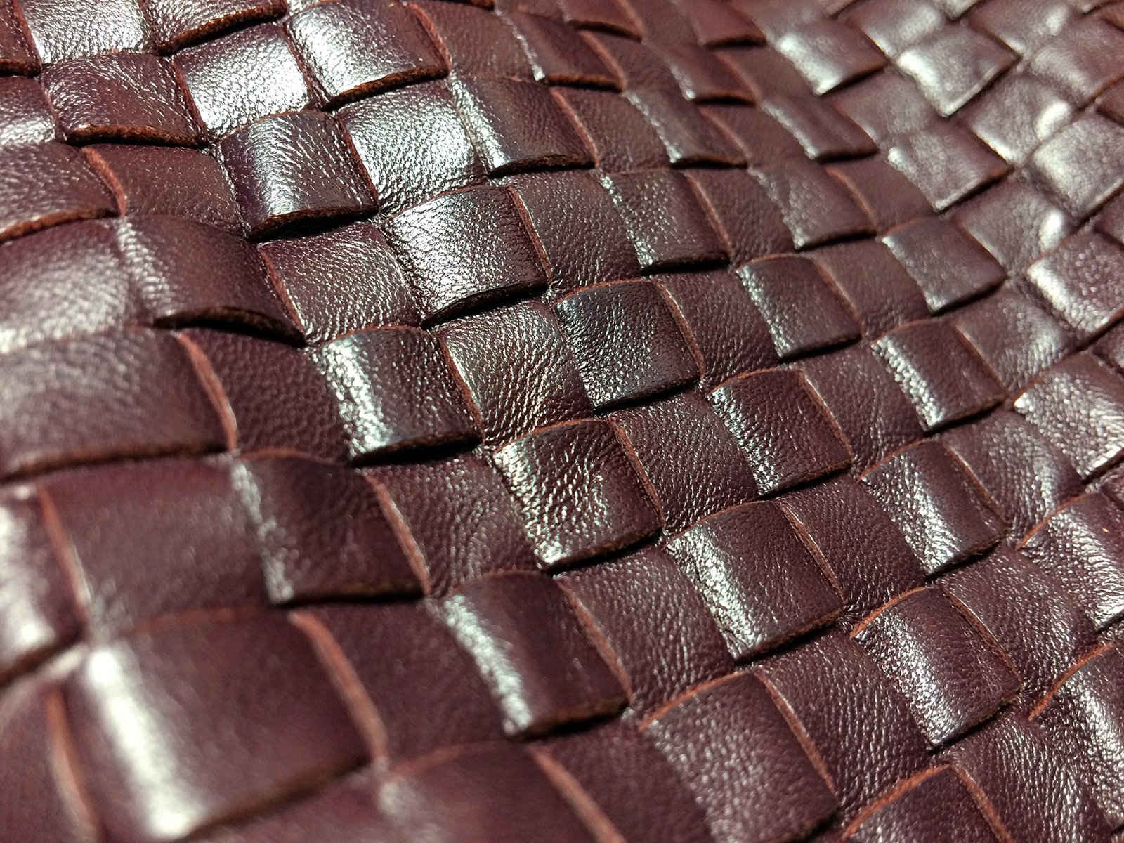 What is the name of Bottega Veneta's signature woven-leather technique, developed in 1966?