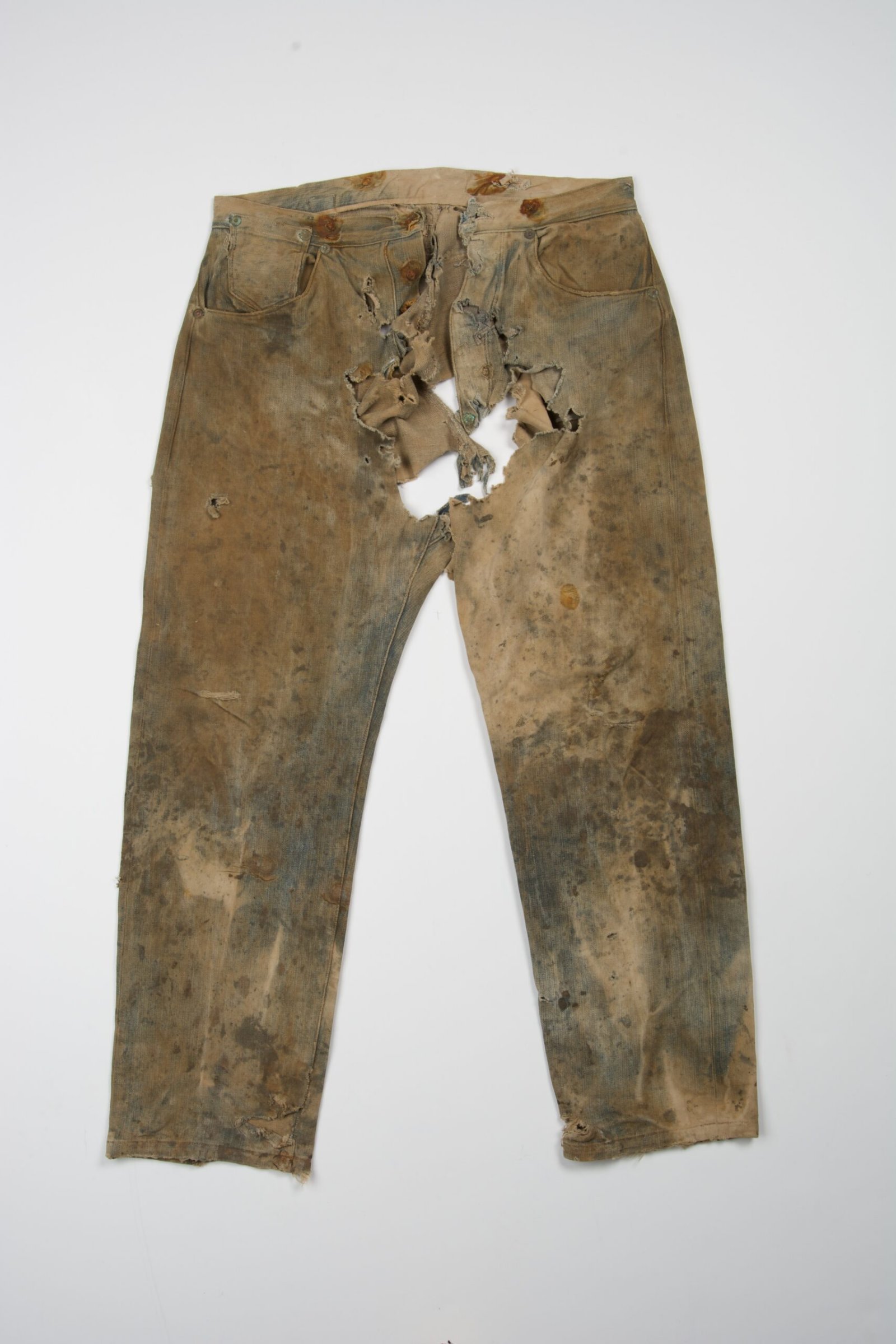 On May 20, 1873, tailor Jacob Davis and Levi Strauss patented a way to strengthen work pants using what small metal hardware?