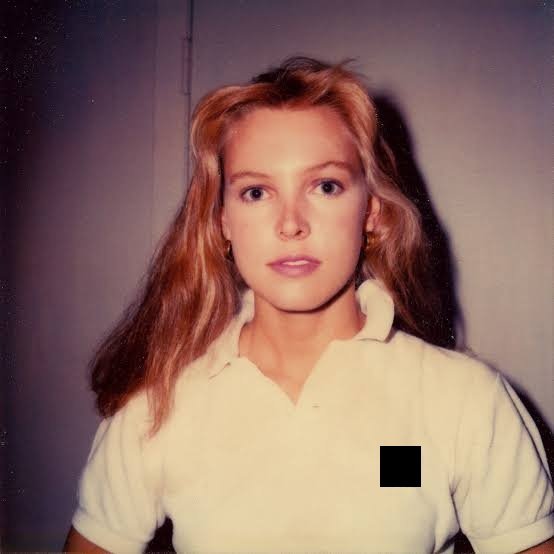 What brand of polo shirt is the woman on the cover of Vampire Weekend’s Contra wearing?