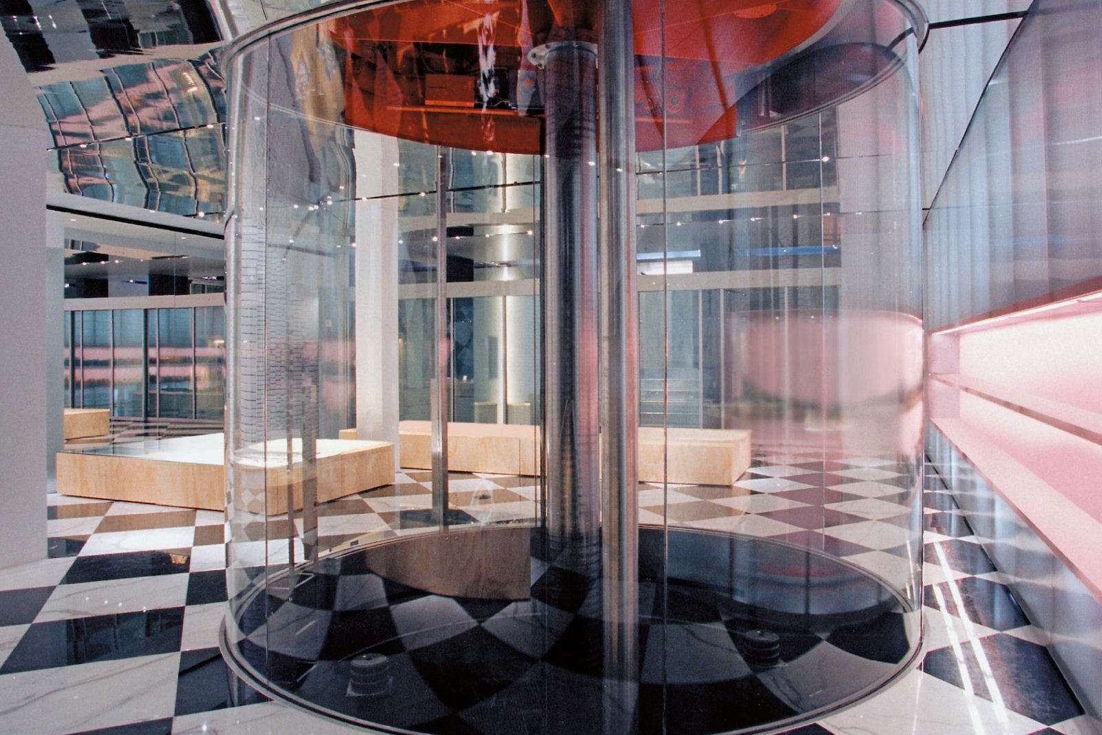 Elevator. The black-and-white marble floor nods to Prada’s first store in Milan (e-architect).