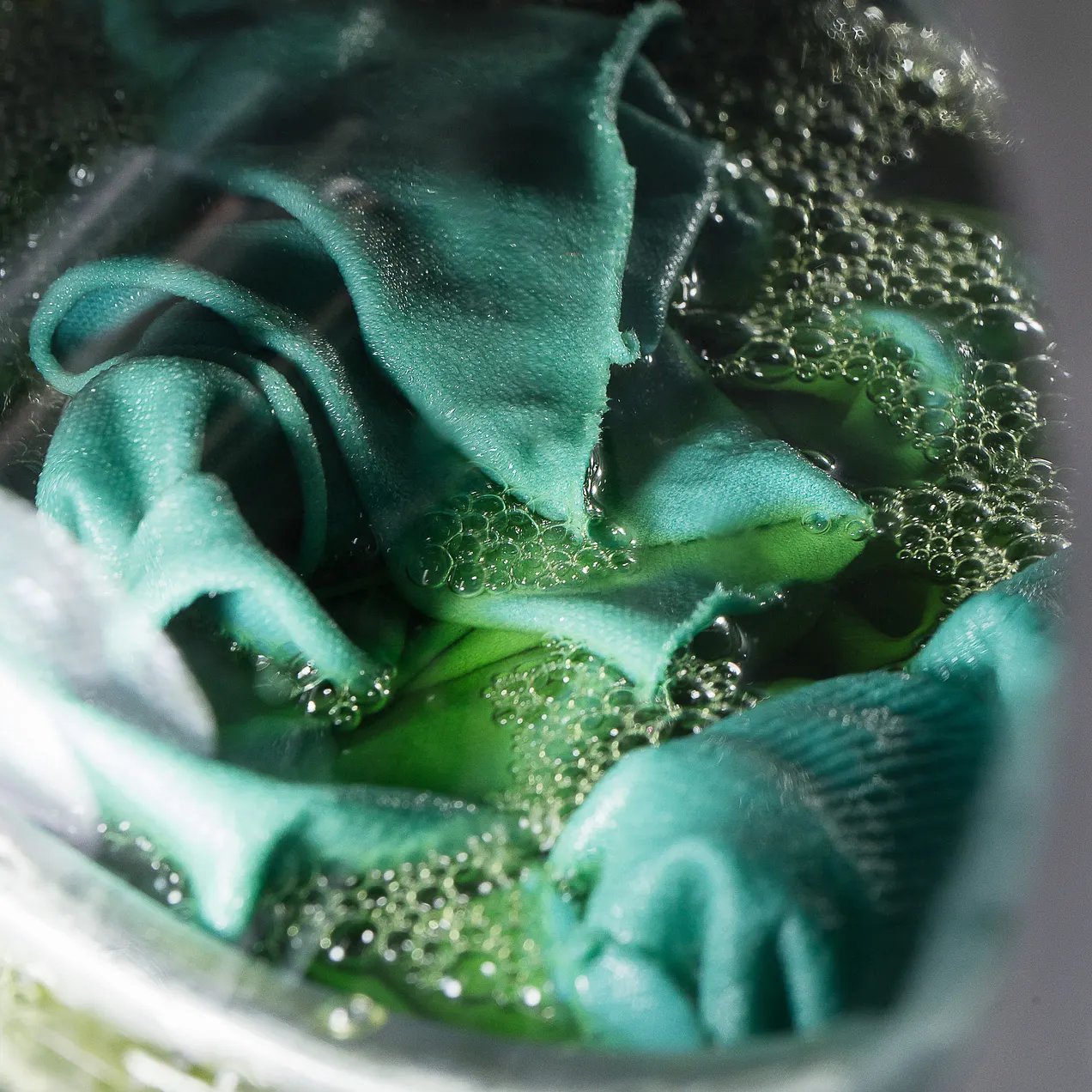 Which Italian designer pioneered garment dyeing: dyeing clothes after they were sewn, instead of dyeing the fabric first?