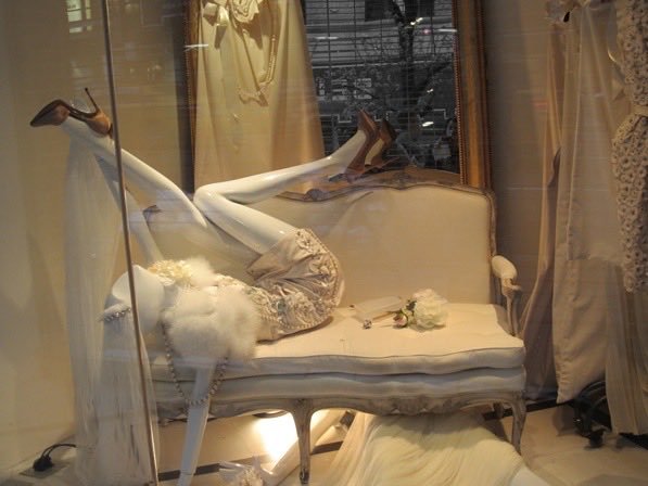 These window displays, staged at a Paris flagship in the late 2000s and early 2010s, belonged to which fashion house?