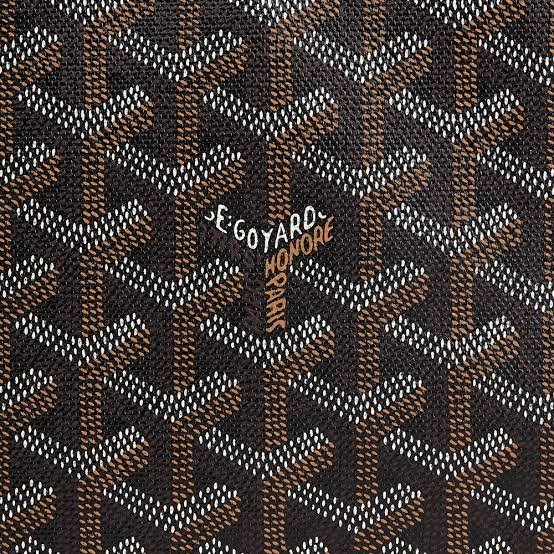 What year was Goyard's iconic chevron 'Goyardine' canvas pattern designed?