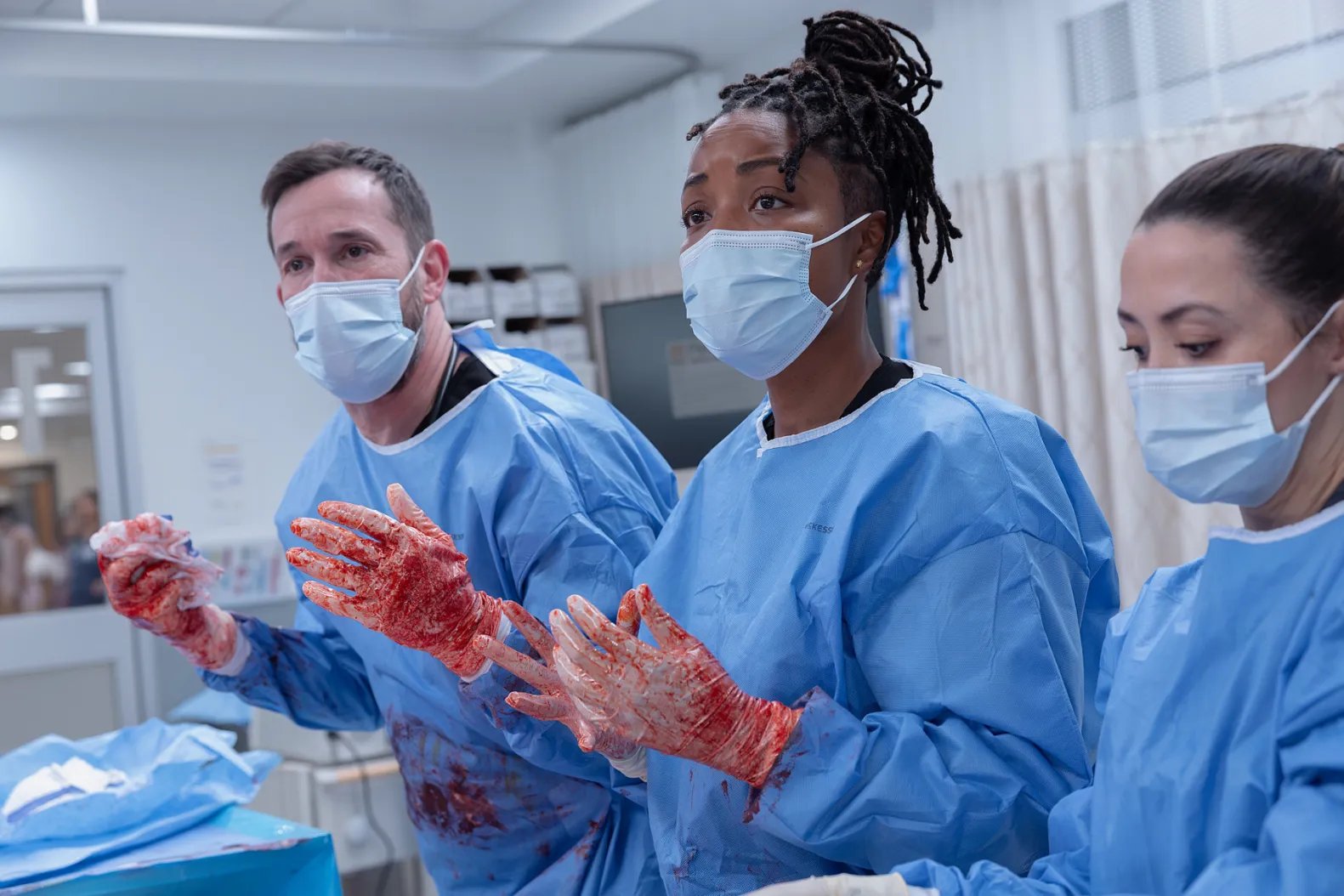 Why are surgical scrubs usually green or blue instead of white?