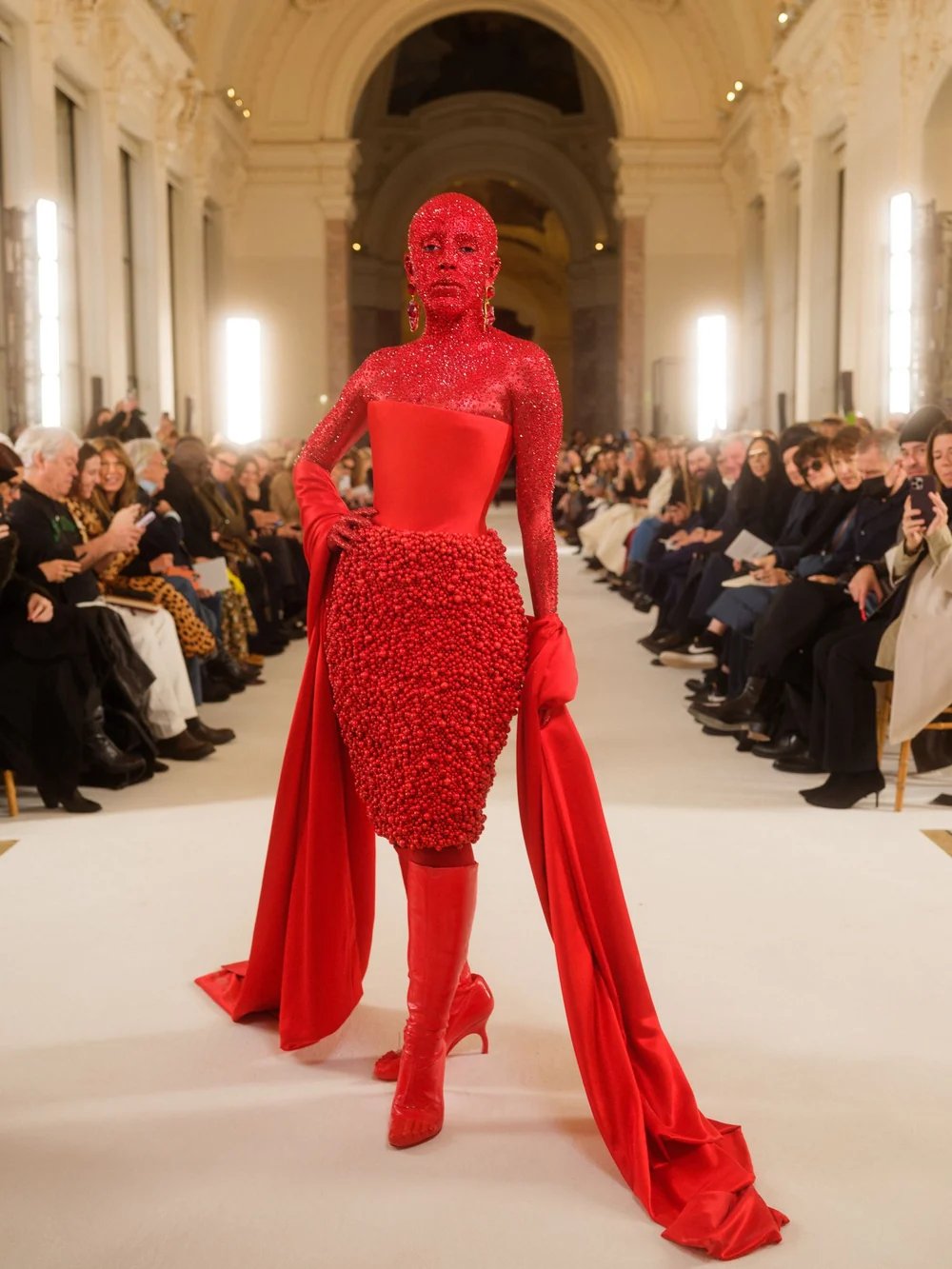 At Schiaparelli's Spring/Summer 2023 Haute Couture show in Paris, Doja Cat attended, covered head-to-toe in a custom look by Pat McGrath. Roughly how many Swarovski crystals were hand-applied to her body and face?
